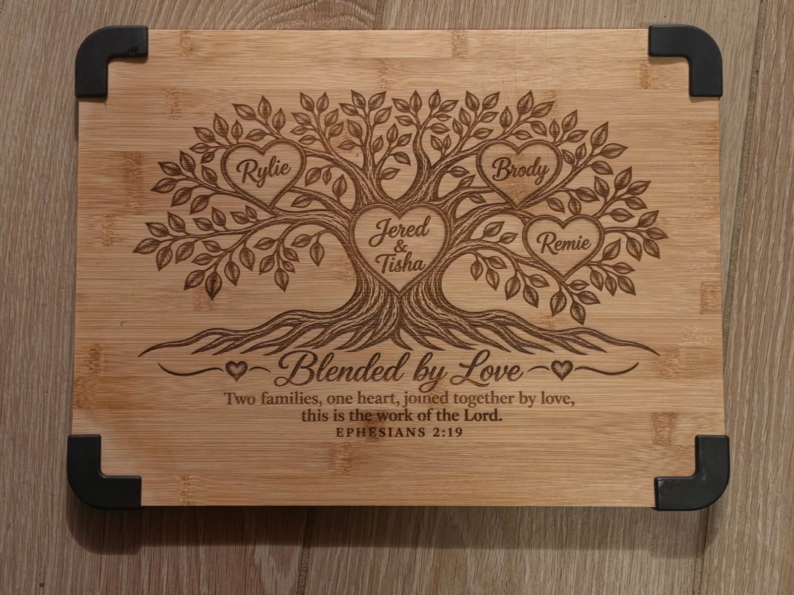 Board engraved with a family tree and Blended by Love